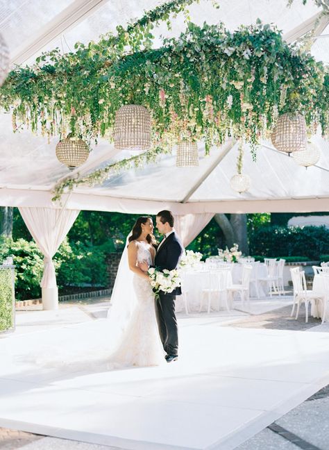 Bride and groom on their white dance floor with hanging flowers in clear tent at Charleston wedding. White Dance Floor Wedding, Tent Dance Floor, Clear Tent Wedding, Flower Child Hair, Thomas Bennett House Wedding, White Dance Floor, Wedding Dance Floor, White Dance, Clear Tent