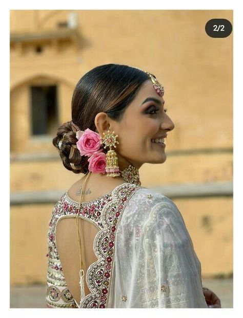 Bloom and Bun: Elegant Hairstyle Ideas for Ladies Who Love Flowers Reception Open Hairstyles Indian, Low Messy Bun With Flowers, Mehendi Hairstyles, Bun Elegant, Candle Pictures, Simple Hairstyle For Saree, Reception Hairstyle, Bun Hairdo, Bridal Buns