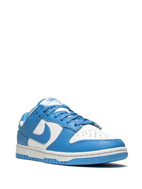 Already seen in many other colourways, the Nike Dunk Low comes now in a new two-tone colour option - in white and 'University Blue'. The pair features white leather across the panels, toe, and ankle, along with the signature perforations on the toe. Then, the 'University Blue' adorns the overlays and Swoosh logos and also hits the tongue branding, laces, liner, and rubber outsole, finishing the look, there's a white midsole. Composition Sole: Rubber 100% Outer: Leather 100% Lining: Fabric 100 University Blue Dunks, Nike Dunk Low University Blue, Dunk Low University Blue, Blue Dunks, Nike Tenis, University Blue, Blue Sneakers, Low Sneakers, Nike Dunk Low