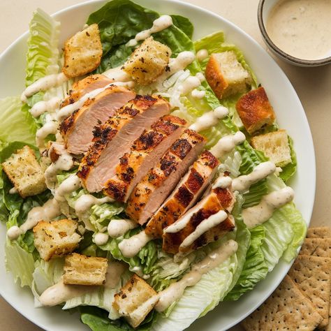 Elevate your salad game with this delicious Chicken Caesar Salad! 🥗🍗 Fresh and flavorful, it's perfect for lunch or dinner! **Ingredients:** - 2 boneless, skinless chicken breasts - 1 tablespoon olive oil - Salt and pepper to taste - 1 large head of romaine lettuce, chopped - ½ cup Caesar dressing - ½ cup grated Parmesan cheese - 1 cup croutons - Fresh lemon wedges for serving (optional) **Directions:** 1. Preheat your grill or skillet over medium-high heat. Season the chicken bre... Salad Restaurant, Dinner Ingredients, Chicken Caesar Salad, Chicken Caesar, Caesar Dressing, Lemon Wedge, Romaine Lettuce, Caesar Salad, Boneless Skinless Chicken