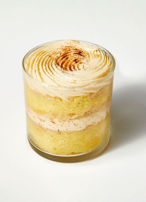 Coconut Cinnamon Tres Leches Cake Jar - a heavenly delight that whisks you away. It's a delectable experience with layers of moist sponge cake infused with irresistible coconut and a delicate hint of cinnamon. Each jar soaks in a trio of creamy milk for an extra luscious texture. Perfect for satisfying sweet cravings and complementing holiday desserts or enjoying as a sweet snack in chilly weather. Cake In Jar, Moist Sponge Cake, Cake Jars, Leches Cake, Dessert Box, Tres Leches Cake, Dessert Boxes, Whisks, Sweet Cravings