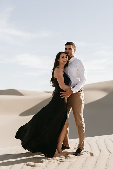 Engagement Photo in Sand Dunes | Couple photoshoot outfits | Alyssa Flores Photography. This engagement photoshoot was a dream! A gorgeous and intimate location for this unique engagement photoshoot session. Discover great sand dunes national park engagement, sand dunes engagement photos black dress, engagement photos on sand and unique engagement theme. Book Alyssa as your engagement photographer at alyssafloresphoto.com. Black Dress Engagement, Sand Dunes Engagement Photos, Couple Photoshoot Outfits, Formal Engagement Photos, Engagement Themes, Couple Photo Ideas, Engagement Outfit Ideas, Dress Engagement, Beach Engagement Photoshoot