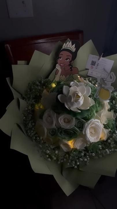 adair on TikTok Princess And The Frog Flower Arrangement, Princess And Frog Bouquet, Princess Tiana Bouquet, Disney Princess Bouquet, Princess Tiana Flower Bouquet, Princess And The Frog Flowers, Princess And The Frog Flower Bouquet, Tiana Bouquet, Princess And The Frog Bouquet