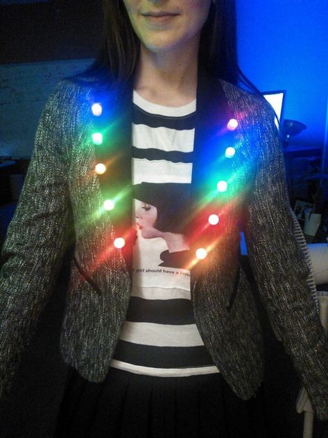 LED Light Costumes: You *can* make LED clothing yourselves, costume crafters, plus take note for Halloween, guys. These LED lights are clip on, you can put them anywhere and everywhere: http://www.flashingblinkylights.com/light-up-products/light-up-flashing-pins-body-lights/blinkies-round-leds.html Costume With Lights, Led Light Costume, Led Jacket, Light Up Clothes, Light Up Costumes, Led Costume, Burning Man Art, Led Clothing, E Textiles