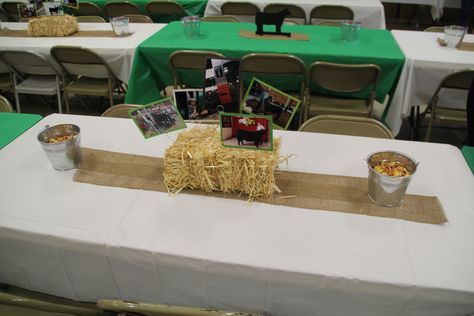 Show cattle theme graduation party.  Burlap runner, straw bale with pictures in it, two galvanized buckets at each end with Chex mixes. 4h Banquet Decorations, Ffa Party Decorations, Tractor Graduation Party, Show Cattle Graduation Party, Western Grad Party Ideas, Ffa Banquet Ideas Decorations, Farm Graduation Party Ideas, Ffa Banquet Centerpieces, Ffa Banquet