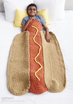 Hot dog! This Hot Diggity Dog! Snuggle Sack is the perfect cozy crochet sleeping bag for your child. Worked up in super bulky and super snuggly blanket yarn and made to look just like a hot dog on a bun, this is an easy snuggle sack pattern that your kids will love. Work this up as a fun birthday present or as a super unique holiday gift. Meant for kids aged 4-8, this hot dog snuggle sack can be easily customized with the toppings of your choice, so go nuts with the mustard and relish - just... Crochet Sleeping Bag, Crochet Snuggle Sack, Crochet Snuggle, Crochet Cocoon, Kids Crochet Pattern, Bernat Blanket Yarn, Crochet Blanket Afghan, Manta Crochet, Blanket Yarn