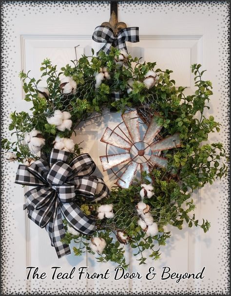 Grapevine wreath form, boxwood greenery, metal windmill, buffalo plaid ribbon and cotton Buffalo Plaid Grapevine Wreath, Farm Wreaths Farmhouse Style, Farmhouse Grapevine Wreath, Farm House Wreaths, Country Wreaths Farmhouse, Windmill Wreath, Metal Wreath Ideas, Farmhouse Wreaths For Front Door, Kitchen Wreaths