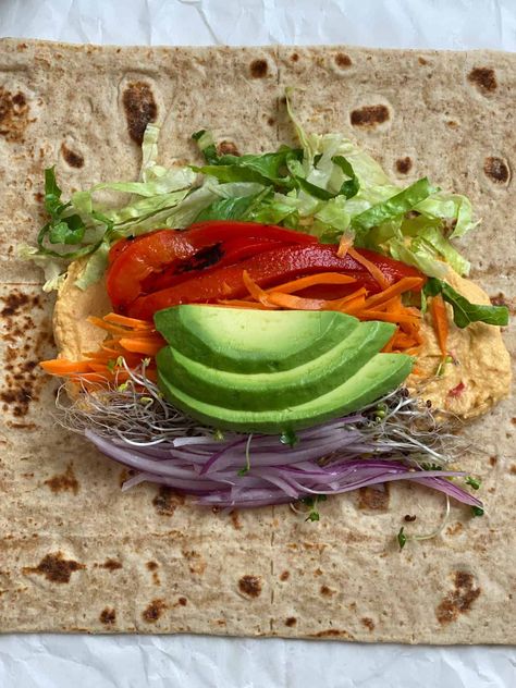 This Easy Hummus Tortilla Wrap is the best! They're simple to make and also great on the go as well. Tasty, easy, and simple to whip up for a go-to meal! #plantbasedonabudget #roasted #red #pepper Wraps Ideas Food, Hummus Tortilla Wrap, Vegetable Wraps Healthy Lunch Ideas, Veggie Wrap Ideas, Vegetarian Wrap Ideas, Wrap Aesthetic Food, Vegetarian Tortilla Wrap, Folded Tortilla Wrap, Wrap Ideas For Lunch