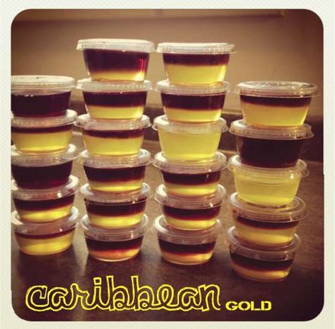 Layered Jello Shots - Caribbean Gold  Makes 22 Jello Shots)    1 3oz Package of Island Pineapple Jello  1 3oz Package of Black Cherry Jello (not pictured in image 1)  Measuring cup  Small condiment cups w/lids (found at party store for $5.99/250)  1 Bottle of Coconut Rum (any brand will work)  1 Bottle of Black Cherry Rum (any brand will work)  1 Pan to sit cups in so that you can more easily transfer shots to the fridge Black Cherry Jello, Cherry Jello Shots, Rum Jello Shots, Jello Shooters, Best Jello Shots, Pineapple Jello, Jello Pudding Shots, Halloween Jello Shots, Island Birthday