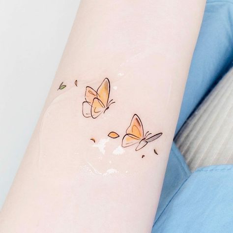 Yellow Butterfly Tattoo Small, Yellow Butterflies Tattoo, Cute Simple Butterfly Tattoo, Tiny Watercolor Tattoo, Small Pastel Tattoo, Butterfly And Sparkle Tattoo, Small Butterfly Tattoo Outline, Baby Butterfly Tattoo, Cartoon Butterfly Tattoo