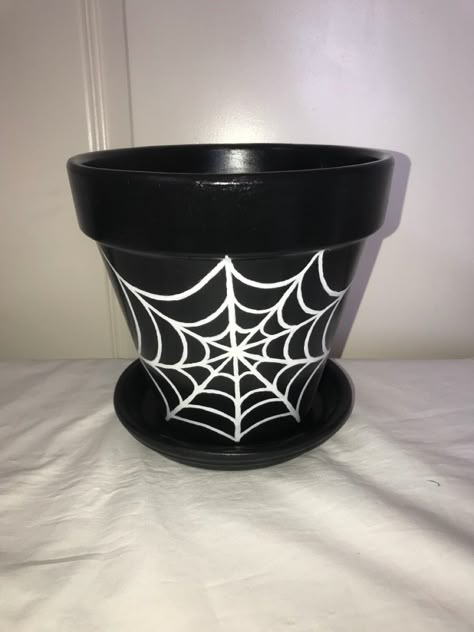 Hand painted terracotta pot and saucer. Dimensions = 7in tall #handpaintedflowerpot #flowerpot #garden #gardendecor #spiderweb Paint Ideas For Flower Pots, Diy Painting Pots, Fall Pot Painting Ideas, Fall Painted Pots, Halloween Painted Pots, Painted Pots Halloween, Halloween Clay Pots To Paint, Goth Pottery Painting, Halloween Painted Flower Pots