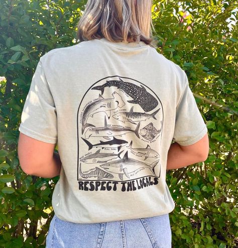 "A hand painted design of all different kinds of sharks in an arch.  \"Respect the Locals\" represents the idea of respecting their home of the ocean. This shirt is slightly oversized, but mostly true to size, and unisex" Respect The Locals, Shirt Sweater, Mens T Shirts, Pullover Shirt, Colorful Hoodies, Mens Graphic Tee, Sharks, The Locals, Shirt Outfit