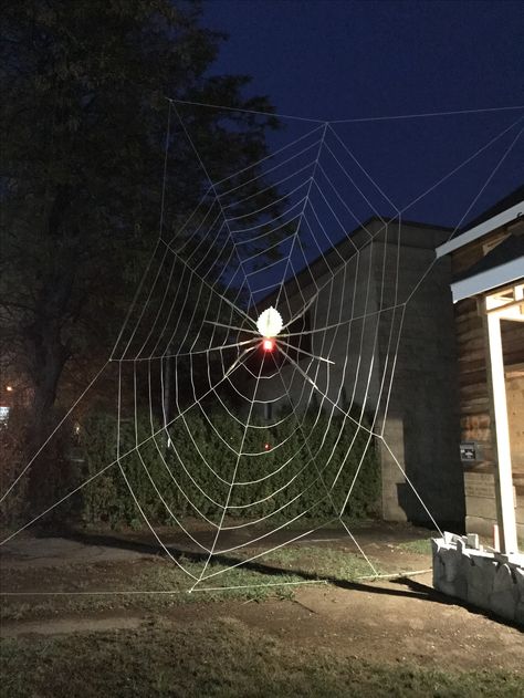 24 foot spider web! (Make your own)! - My husband built this using white rope (about 600 feet) and zip ties. He built it on the ground and then strung it up. #halloween #diy #halloweendecoratingideas #halloweendecor #spookie #spiderweb Halloween Webs, Halloween Web, White Rope, Halloween 2, Up Halloween, Zip Ties, On The Ground, Holiday Decorations, Spider Web