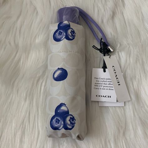 Coach Signature Blueberry Mini Umbrella *New With Tags, Unused *Mini Umbrella *Chalk Signature With Blueberry Printed Nylon *Lilac Acrylic Handle And Nylon Strap *Includes Matching Nylon Case Coach Umbrella, Mini Umbrella, Coach Accessories, House Inspo, Chalk, Umbrella, Lilac, Blue And White, Women Accessories