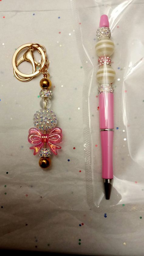 Beautiful beaded pen perfect for back to school or Christmas  a gift that any teacher will love. One that will not be hard to be misplaced are lost. also a beautiful key ring to match listing includes a beaded pan key ring and a little thank you card with the heart charm