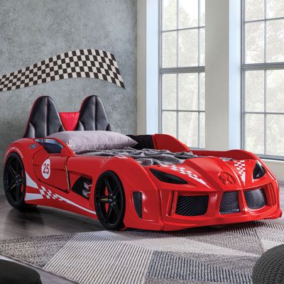 Let's take a drive to dreamland with this sleek designed race car bed. With a realistic magnetic door that brings you in and out from that restful slumber. This bed is not just aesthetically pleasing but has some awesome features like embedded LED wheel lights and headlight night lights, and can select for music/sound effects via wireless remote controller for endless bedtime imagination. | Zoomie Kids Kaibito Twin Car Bed w/ Lights, Blue Red 34.5 x 49.25 x 91.75 in, Upholstered | C008020014_122 Twin Car Bed, Twin Car, Race Car Bed, Headboard Shapes, Kids Twin Bed, Kids Bed Frames, Red Race, Led Beds, Bed With Led Lights