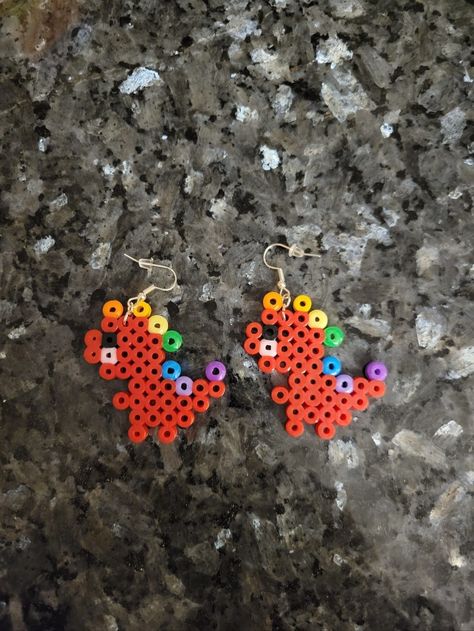 Red Dino perler bead earrings T Rex Perler Bead Pattern, Red Perler Bead Patterns, Pearler Bead Earrings Diy, Mini Perler Bead Patterns Earrings, Christmas Perler Bead Earrings, Dino Perler Beads, Perler Bead Dinosaur, Perler Bead Earrings Patterns, Dinosaur Perler Bead Pattern