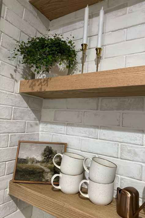 I’m so excited about my kitchen coming together! It’s the little things that really make it homey! I was able to put together these floating shelves along with laying the brick as my back splash and I am in LOVE with how it turned out!!! You can check out my instagram to see how I was able to brick as well as put together these floating shelves! Brick Backsplash With Floating Shelves, Floating Shelves On Brick Wall Kitchen, Backsplash With Floating Shelves, White Brick Backsplash, Brick Wall Kitchen, Painted Brick Wall, Diy Floating Shelves, White Wash Brick, Wooden Floating Shelves