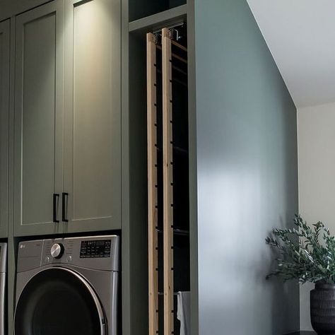 Melissa Manzardo Hryszko on Instagram: "Dreamy laundry room alert for you to feast your eyes on today. 
This space is efficient and beautiful with the custom cabinetry and @dryaway drying racks. 
I also want to answer the questions I always get when I post a laundry room with a raised washer and dryer like this. 
There is a drain under the washer; there is also a water bug that is connected to the security system that alerts the homeowners if there is any water, the water shut-offs are under the sink cabinet in case of an emergency and installation is easy, at least for our crew. 
.
.
.
.
.
#laundry #laundryroom #homeorganization #dreamhome #housegoals #northglenmorecustom1" Dry Rack Laundry Ideas, Hidden Washer And Dryer, Raised Washer And Dryer, Under The Sink Cabinet, Dryer Cabinet, Water Bug, Laundry Room Sink, Drying Racks, Drying Rack Laundry