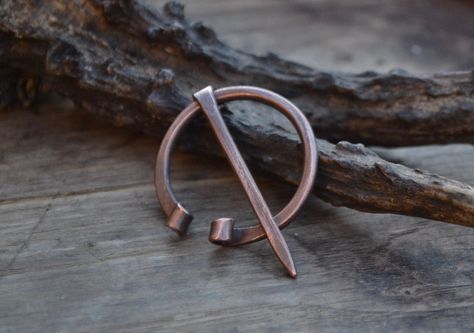 ".:.  Copper penannular brooch .:.  I handforged this shawl pin from a thick recycled copper wire. Penannular (\"Annular\" means formed as a ring and \"penannular\" formed as an incomplete ring) brooches feature a long pin attached by its head to a ring; the pin can move freely around the ring as far as the terminals. There is a gap between the terminals wide enough for the pin to pass through. Beginning as utilitarian fasteners in the Iron Age and Roman period, and in Ireland and Scotland from Ireland And Scotland, Shawl Pin, Ancient Egyptian Art, Iron Age, Anglo Saxon, Shawl Pins, Ancient Aliens, Egyptian Art, Bronze Age