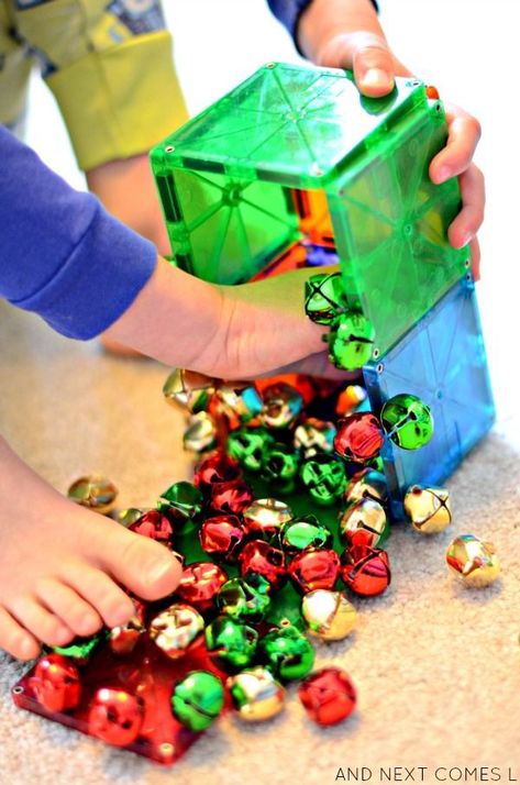 Christmas science for toddlers and preschoolers using Magna-Tiles and jingle bells from And Next Comes L Stem Activity For Kids, Christmas Science Activities, Christmas Stem Activities, Christmas Activities For Toddlers, Christmas Learning, Preschool Christmas Activities, Science For Toddlers, Magna Tiles, Christmas Units