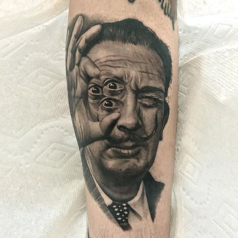 Dali portrait tattoo by Jamie Mahood #JamieMahood #finearttattoos #blackandgrey #realism #realistic #hyperrealism #salvadordali #Dali #portrait #eye #thirdeye #surreal #painter Salvador Dali Tattoo, Dali Portrait, Finger Tattoos Words, Egyptian Eye Tattoos, Dali Tattoo, Mexican Art Tattoos, Surreal Tattoo, Chest Piece Tattoos, Sketch Tattoo Design