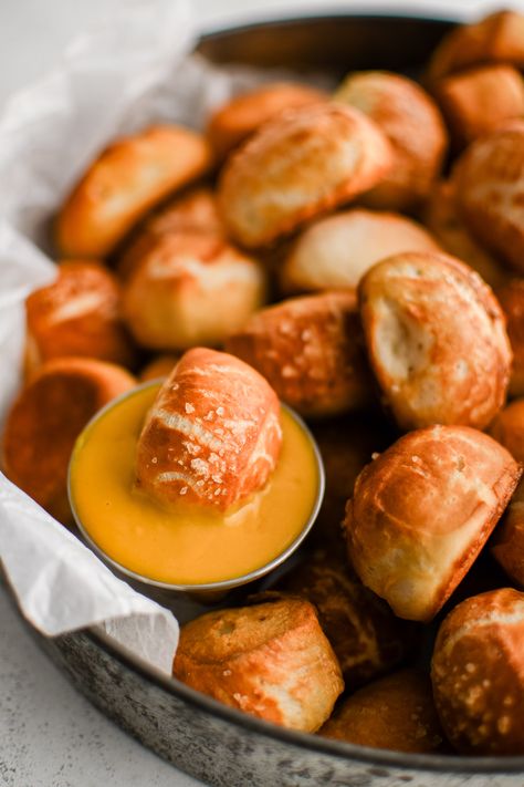 These warm and buttery-soft Homemade Pretzel Bites are so easy to make and taste just like your favorite mall pretzels. Perfect for parties and game days, serve these irresistibly delicious little pretzel bites plain, coated in cinnamon and sugar, or with your favorite dip, like hot cheese sauce or stone ground mustard. Mall Pretzels, Pretzels Bites, Homemade Soft Pretzel Bites, Homemade Pretzel Bites, How To Make Pretzels, Stone Ground Mustard, Homemade Pretzel, Soft Pretzel Bites, Pretzel Recipe