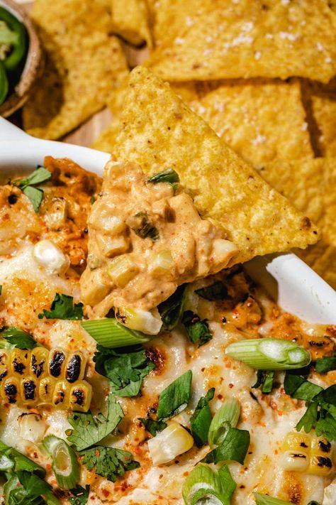 This creamy and delicious Elote Dip features all the flavors of Mexican Street Corn in dip form! Made with a blend of mayo, cream cheese, lime juice, elote seasoning, and fire-roasted corn and topped with cilantro, cotija cheese, diced jalapenos, and green onions. The perfect dip just in time for summer! Corn Queso Dip, Cotija Cheese Recipes, Elote Seasoning, Elote Dip Recipe, Mexican Street Corn Elote, Elote Dip, Corn Elote, Mexican Street Corn Dip, Corn Dip Recipes