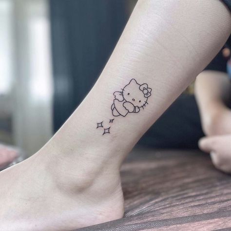 Hello Kitty Angel Tattoo, Tattoo Code, Sanrio Tattoos, Hello Kitty Tattoo, Maching Tattoos, Kitty Tattoo, Hello Kitty Tattoos, Tattoo Fails, Pretty Tattoos For Women