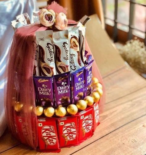 Chocolate tower Now just @880Rs/-❣️ Dm for orders🤍 @crafting_with_zana #chocolates#chocolatetower#decors#gifts#surprise#lovedone#spcldays#memories#love#happiness#handmadewithlove#offerprice#available#entreupreneur#crafter#passionate#success#enjoy#explore#reel#photography#loveyourself Chocolate Tower, Chocolate Hampers, Wedding Gifts Packaging, Flower Wallpapers, Gifts Packaging, Cute Flower Wallpapers, Bridal Mehndi Designs, Bridal Mehndi, How To Make Chocolate