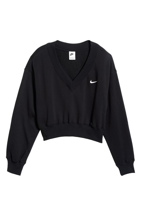 Minimally branded with an embroidered Swoosh, this classic sweatshirt is reimagined with a V-neck and cropped length. 19 1/2" length (size Medium) V-neck Ribbed cuffs and hem 80% cotton, 20% polyester Machine wash, tumble dry Imported Nike Spark, Nike Sportswear Phoenix Fleece, Nike Crop Top, Creative T Shirt Design, Cute Nike Outfits, Nike Sweater, Comfy Sweatshirt, Sporty Outfits, Nike Outfits