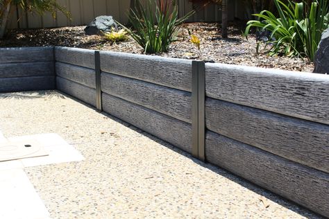 Ridgi Gumtree concrete sleeper & steel post retaining wall. Available at Bunnings Warehouse Wood Landscape Edging, Concrete Sleeper Retaining Walls, Concrete Garden Edging, Steel Retaining Wall, Sleeper Retaining Wall, Beach House Landscaping, Concrete Sleepers, Stone Walls Garden, Garden Retaining Wall