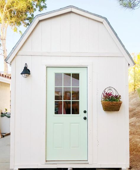 White shed with mint green door and black sconce Mint Green Door, She Shed Exterior, Trailer House Remodel, Green Home Exterior, White Shed, House Exterior Before And After, Small House Remodel, Outdoor Yard Ideas, I Ready