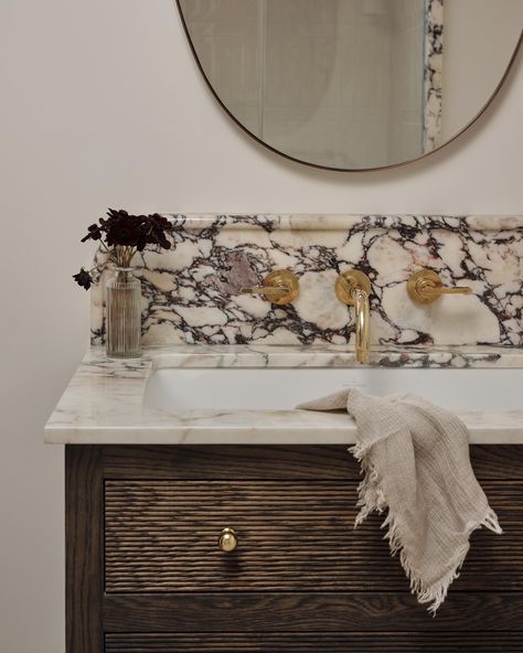 A lovely little shared bathroom at a recent project. With clients who loved marble but didn’t want to go over the top on a bathroom which would only be used occasionally, we sourced some beautiful Calacatta to use as the vanity top with textural details like the pencil backsplash, and followed through in accents around the shower which used more cost-effective handmade ceramic tiles as it’s main finish. Design @jessogradydesign Photographer @astridtemplier #bathroomdesign #marblebathroom... Calacatta Bathroom, Can We Talk, Handmade Ceramic Tiles, Marble Bathroom, Shared Bathroom, Vanity Top, Over The Top, Handmade Ceramic, Shower Heads