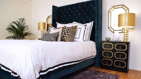 Glamorous navy blue and gold Hollywood Regency bedroom showcases a stunning tall navy blue velvet tufted wingback headboard supports a navy blue velvet bed sat on a purple overdyed rug and dressed in black border bedding accented with animal print pillows. Gold Bedroom Ideas, Blue Velvet Headboard, Regency Bedroom, Hollywood Regency Bedroom, Blue And Gold Bedroom, Velvet Headboard, Gold Bedroom, Velvet Bed, Blue Bedroom