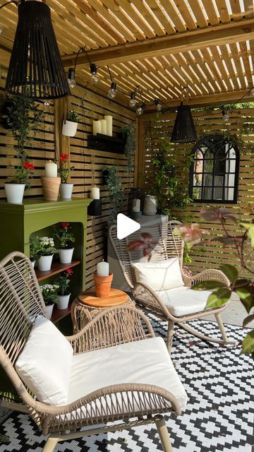 Claire Champion on Instagram: "Garden Shelter Ideas 

I always get questions about our garden shelter so i thought I’d share what we did to create this space and where we bought things from. 

The garden shelter itself is from @jacksonsfencing and comes as a kit you can install yourself or pay for installation.  We paid extra for a polycarbonate roof so it stays dry all year round. 

Details:

Rocking chairs @aldispecialbuysuk 
Table - laundry basket flipped upside down  @shopmatalan 
Cupboard @ikeauk 
Plant shelves - upcycle from the charity shop
Mains powered festoon lights @ikeauk 
Accessories, including rug, solar lights, mirror all from high street shops such as B&M, JYSK, Dunelm. 

Let me know if you want details on anything I haven’t mentioned or have any questions 

#gardenshelter Undercover Garden Ideas, Undercover Garden Area, Garden Shelter Ideas, Hidy Hole, Table Laundry, Garden Shelter, Landscape Meadow, Polycarbonate Roof, Redesign Ideas