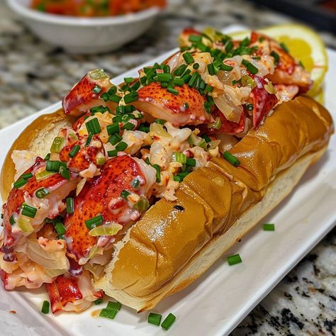 🦞🌊 Dive into the taste of the coast with a classic Maine Lobster Roll! #LobsterRoll #SeafoodDelight 🍽️ Maine Lobster Roll 🛒 Ingredients: 4 fresh lobster tails (about 450 grams of lobster meat) 4 New England-style hot dog buns 2 tablespoons mayonnaise 1 tablespoon lemon juice 2 celery stalks, finely chopped Salt and black pepper to taste Butter for toasting Chives for garnish �👩‍🍳 Instructions: Cook Lobster: Boil lobster tails for about 8 minutes. Cool, then chop meat. Mix: Combine lobster ... Boil Lobster Tail, Maine Lobster Roll, Cook Lobster, Lobster Boil, Fresh Lobster, Instagram Recipes, How To Cook Lobster, Lobster Meat, Twisted Recipes