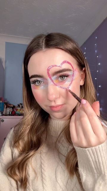 Amy Skelton on Instagram: "Trying the tape makeup trend but inspired by Taylor swift 💖🏹☁️ #makeuptrends #taylorswiftmakeup #tapemakeup" T Swift Makeup, Taylor Swift Face Painting Ideas, Evermore Makeup Taylor Swift, Taylor Swift Face Paint Ideas, Taylor Swift Album Inspired Makeup, Tape Makeup Trend, Rep Makeup Taylor Swift, Taylor Swift Face Paint, Ttpd Makeup Ideas Taylor Swift