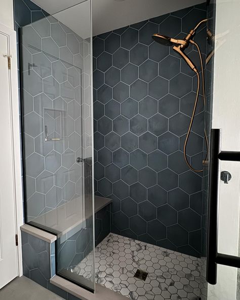 {Kids bathroom reno!! Love this blue tile and the balance of the floor tiles that pull that blue in a little. This is one of our favorite shower fixtures to use when people want a simple hand held and a separate shower head. Makes it really easy to clean the shower when you have the hand held and also great to bathe pups ☺️} Blue Hexagon Shower Tile, Cool Shower Tile, Shower Tile Designs Unique Accent Wall, Small Tiled Shower Ideas, Walkin Shower Tile Ideas, Modern Shower Tile Ideas, Purple Farmhouse, Walk In Shower Tile Ideas, Modern Shower Tile