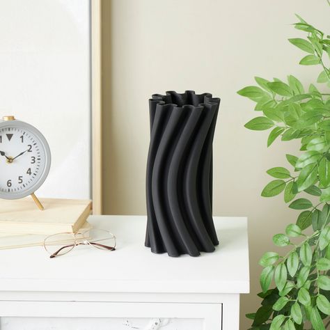 Black ceramic wavy vase can serve as an elegant centerpiece for your dining table or living room, enhancing the aesthetic beauty of your home decor. Abstract Vase, Elegant Centerpiece, Contemporary Vases, Colored Vases, Elegant Centerpieces, Grey Ceramics, Vase Centerpieces, Aesthetic Beauty, Minimalist Aesthetic