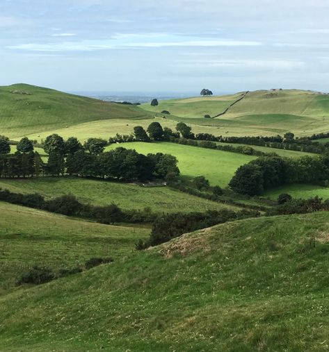 The many shades of green in an Irish countryside speak to me of Spring. The sea is visible in the distance as your gaze takes you past the gently rolling hills…a quintessential scene of pastoral beauty. Behind me on a high hill sits an ancient Irish Passage Tomb holding the secrets of the early people who made their homes in this beautiful land. Scotland Aesthetic, Ancient Irish, Speak To Me, Irish Countryside, Irish Landscape, Irish Cottage, Hills And Valleys, Countryside Landscape, Ancient Forest