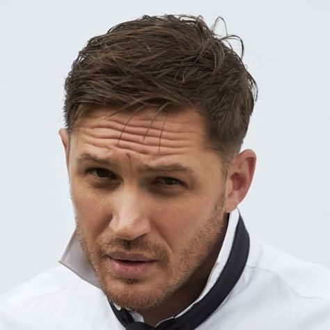 Hardy is sporting a tapered cut that features a crown that is left  relatively long. This allows the tapered cut to be styled either slicked  back, spiked, ... Tom Hardy Hair, Tom Hardy Beard, Tom Hardy Haircut, Bad Beards, Gentleman Haircut, Top Haircuts For Men, Spring Haircuts, Hair Myth, Beard Growth