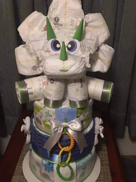 Diaper Cake Dinosaur Theme, Land Before Time Baby Shower Ideas, Dinosaur Diaper Cake, Dinosaur Baby Shower Games, Creative Baby Shower Gifts, Dinosaur Baby Shower Theme, Diaper Gifts, Diaper Cake Boy, Baby Shower Diaper Cake