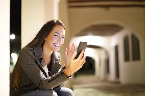 Happy woman having a video call with a smart phone in the night in the street Spain Images, Street Stock, Phone Cover Design, Happy Woman, Great Place To Work, Social Determinants Of Health, Talent Acquisition, Quotes Disney, Video Call