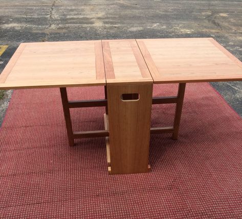 "This  Maple Dining Table is perfect for small confined spaces. This is also perfect for holiday celebrations when extra table space is required.  Easily folds out with one person.  Convenient handles built in to allow you to place table in storage when not in use.   (Pictures show table in raw cherry, this listing is for maple wood) Raw and unfinished In Fold Down Position Table Measures 15 1/4\" w x 36\" l x 30\" h.  In Fold Out Position Table Measures 65\" l x 36\"w x 30\" h." Cherry Dining Table, Gerobak Dorong, Maple Dining Table, Foldable Dining Table, Fold Out Table, Folding Dining Table, Table For Small Space, Foldable Table, Folding Furniture