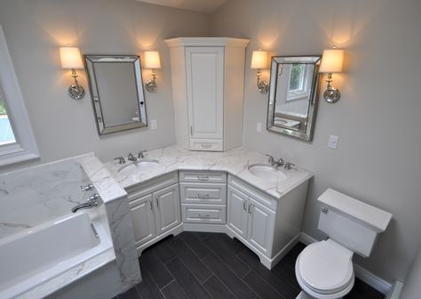 Custom Master Bathroom, with double corner vanity, tower cabinet, wall sconces, toilet and built in tub area. Corner Double Vanity, Beautiful Bathroom Cabinets, Corner Bathroom Vanity, Custom Bathroom Cabinets, Corner Bathroom, Large Bathroom, Cabinet Bathroom, Custom Bathroom, Double Sink Bathroom