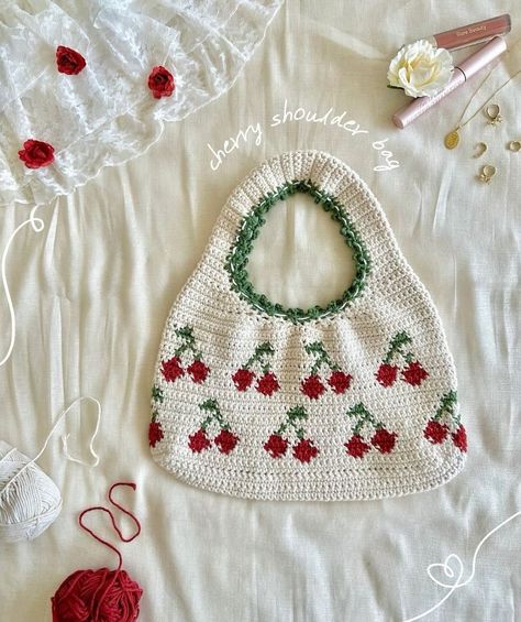 🍒 crochet cherry shoulder bag 🍒 i think this just might be my favourite thing i’ve ever made?! the colourwork, the edging along the strap, and of course, the super adorable cherries - safe to say, i will now be wearing this everywhere 😁 i might just whip up a pattern for this if anyone’s interested ;) 🏷️ #crochet #crochetinstagram #crochetinspo #crochetinspiration#crochetideas #instacrochet #instacrocheting #crochetpattern #crochetbag #crochetbags #crochetlover #crafts #yarn #yarnlove #han... Cherry Crochet Pattern, Cherry Blanket, Cherry Crochet, Crochet Cherry, Crochet Handbags Patterns, Puff Stitch, Crochet Purse Patterns, Crochet Lovers, Purse Patterns