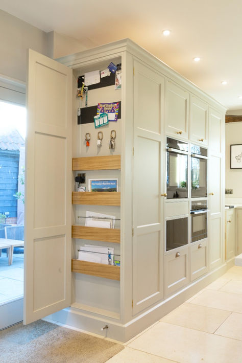 This hidden cupboard is perfect for storing the less aesthetic bits and bobs that you acquire but don't want to get rid of. We have disguised this in an end panel for easy access but keeping it concealed. Click for project details #BakerandBaker Kitchen Ideas Storage Cabinets, Decorative End Panels For Cabinets, Hidden Cupboard Kitchen, Kitchen Storage Cupboard Ideas, Pantry Cupboards Ideas, End Cabinet Storage, Hidden Office In Kitchen, Howdens Kitchen Storage Ideas, Concealed Storage Wall