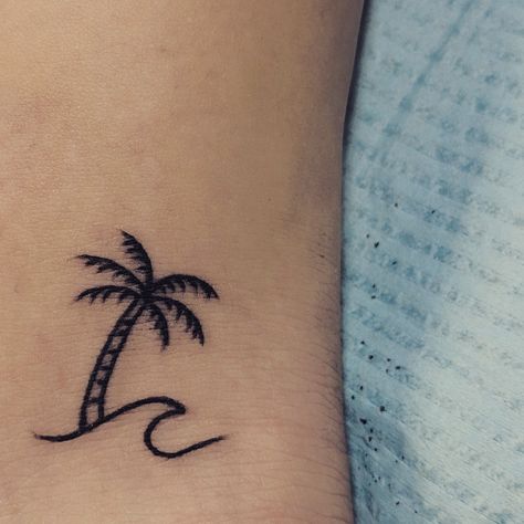 Palm Tree & Wave minimalist tattoo Palm And Wave Tattoo, Wave Tattoo With Palm Tree, Palm Tree Henna Tattoo, Wave Tree Tattoo, Small Palm Tree And Wave Tattoo, Wave With Palm Tree Tattoo, Little Palm Tree Tattoo, Palm Tree Tattoo Minimalist, Palm Tree Wave Tattoo