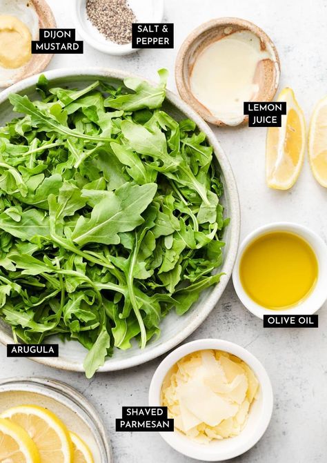 This easy arugula salad is ready in just five minutes! Shake some olive oil, lemon juice, and Dijon mustard together in a jar for a quick dressing, then toss it all up with plenty of fresh arugula and parmesan cheese. Mix it up by adding your favorite cheeses (we like blue cheese, feta, or goat cheese, protein like chicken or salmon, or extra fruits and veggies like avocado, beets, strawberries, or tomatoes. This is a perfect blank canvas salad for a quick, healthy side dish! Vegetarian. Mango Avocado Arugula Salad, Goat Cheese Arugula Salad, Healthy Arugula Salad, Salmon Arugula Salad, Arugula Side Salad, Italian Apps, Argula Salad, Lemon Arugula Salad, Easy Arugula Salad